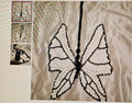 Butterfly design embroidered on fabric with close-up insets showing details.