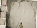 Light gray pants with a textured pattern on a textured background