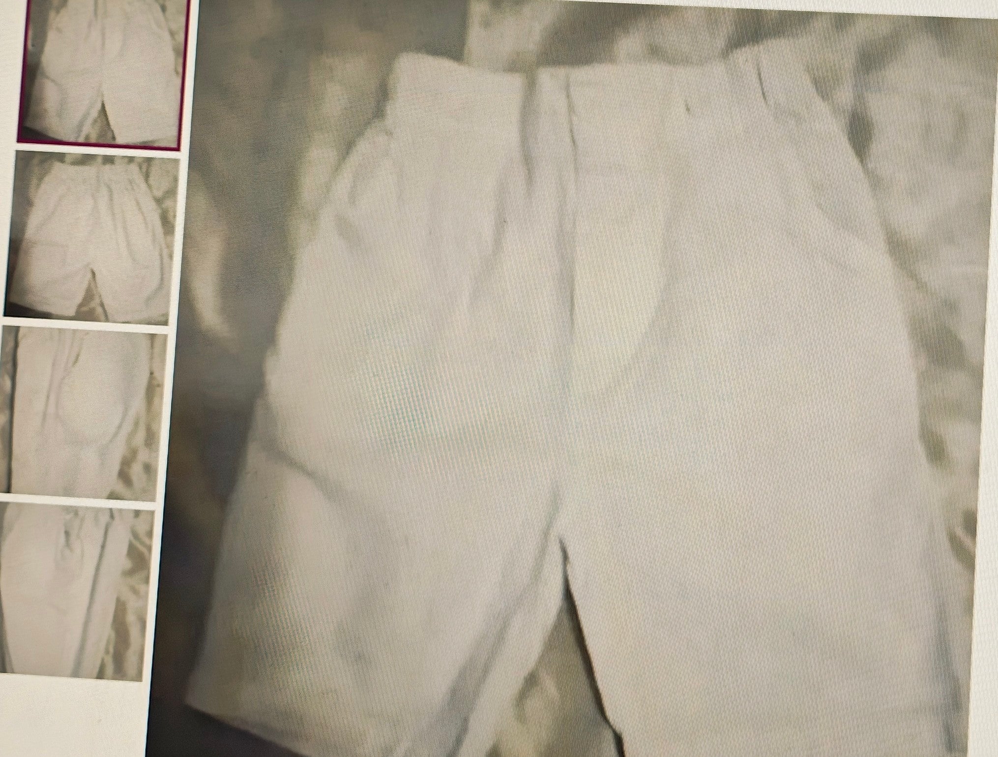 Light gray pants with a textured pattern on a textured background