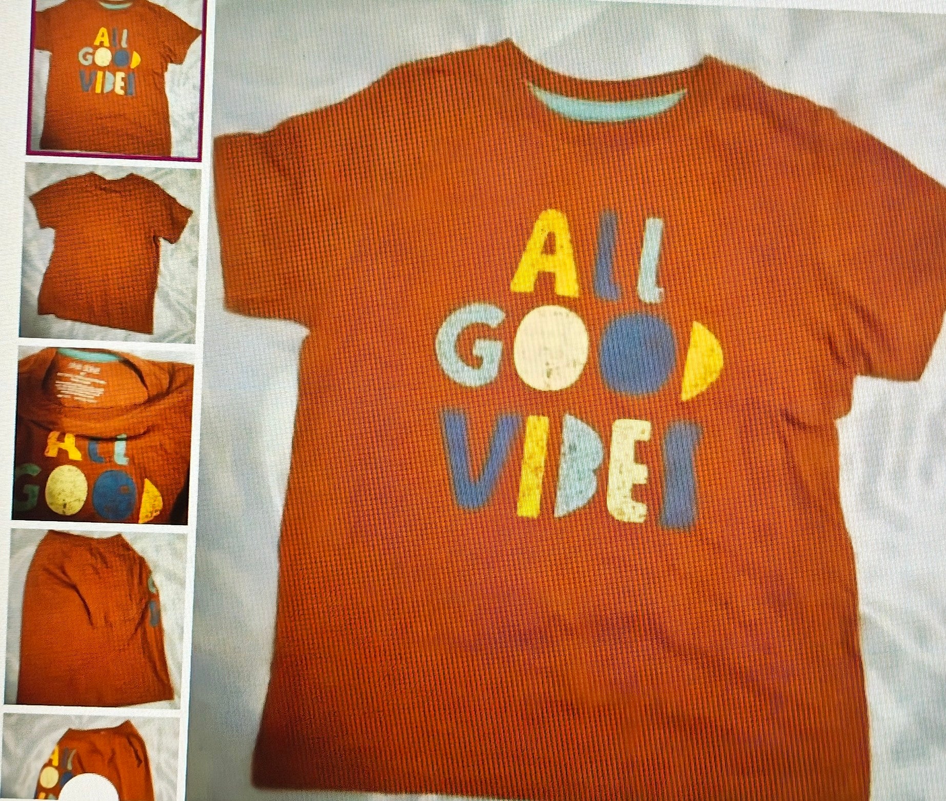 Orange t-shirt with 'All Good Vibes' text on a white background