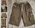 Brown pants with star and moon design on a textured surface