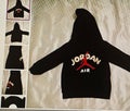 Black hoodie with Jordan Air logo on a textured surface