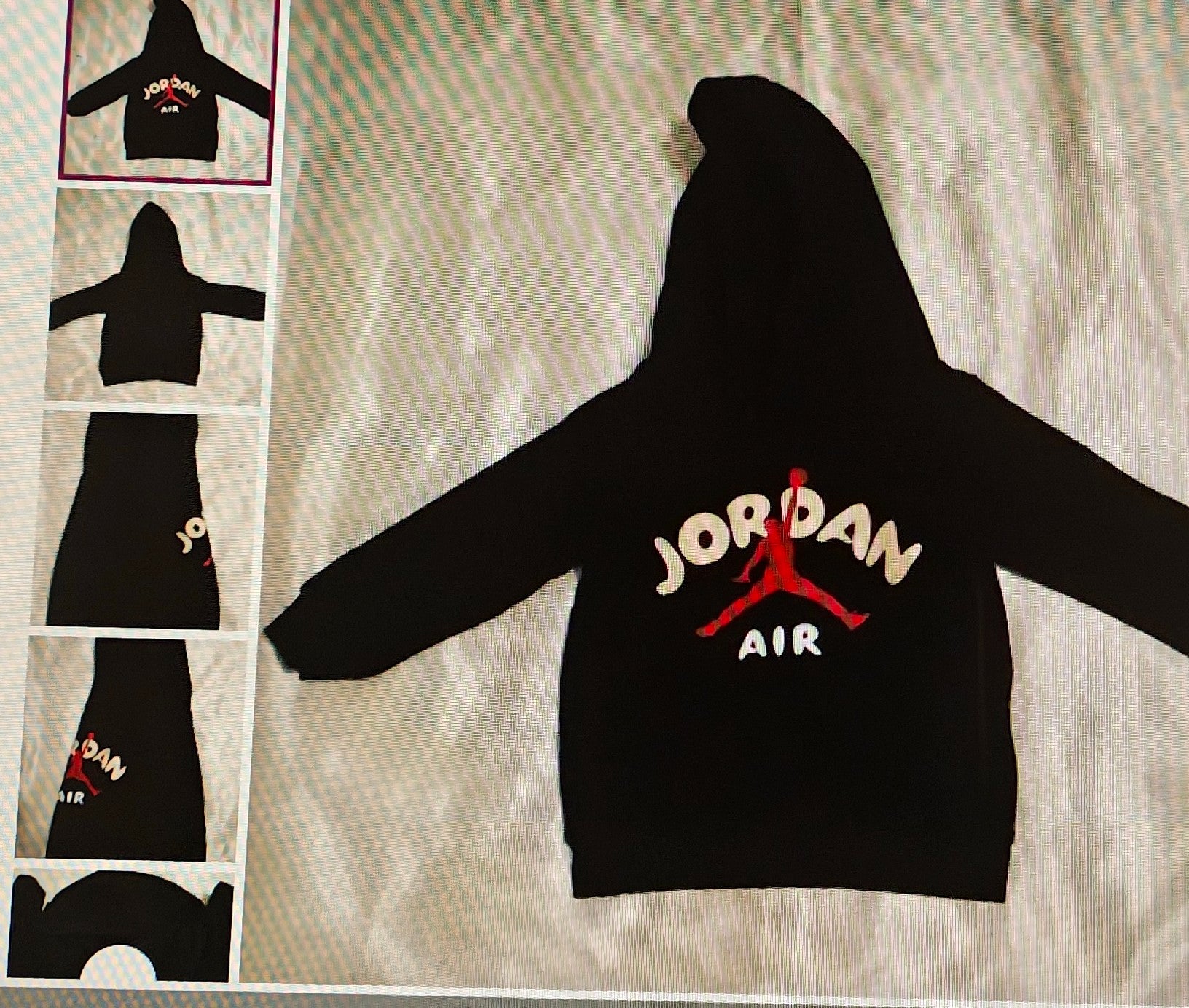 Black hoodie with Jordan Air logo on a textured surface