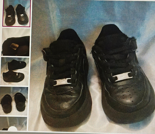 Pair of black sneakers on a light blue fabric background with inset images showing different angles.