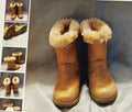Pair of brown boots with fur trim on a gray background