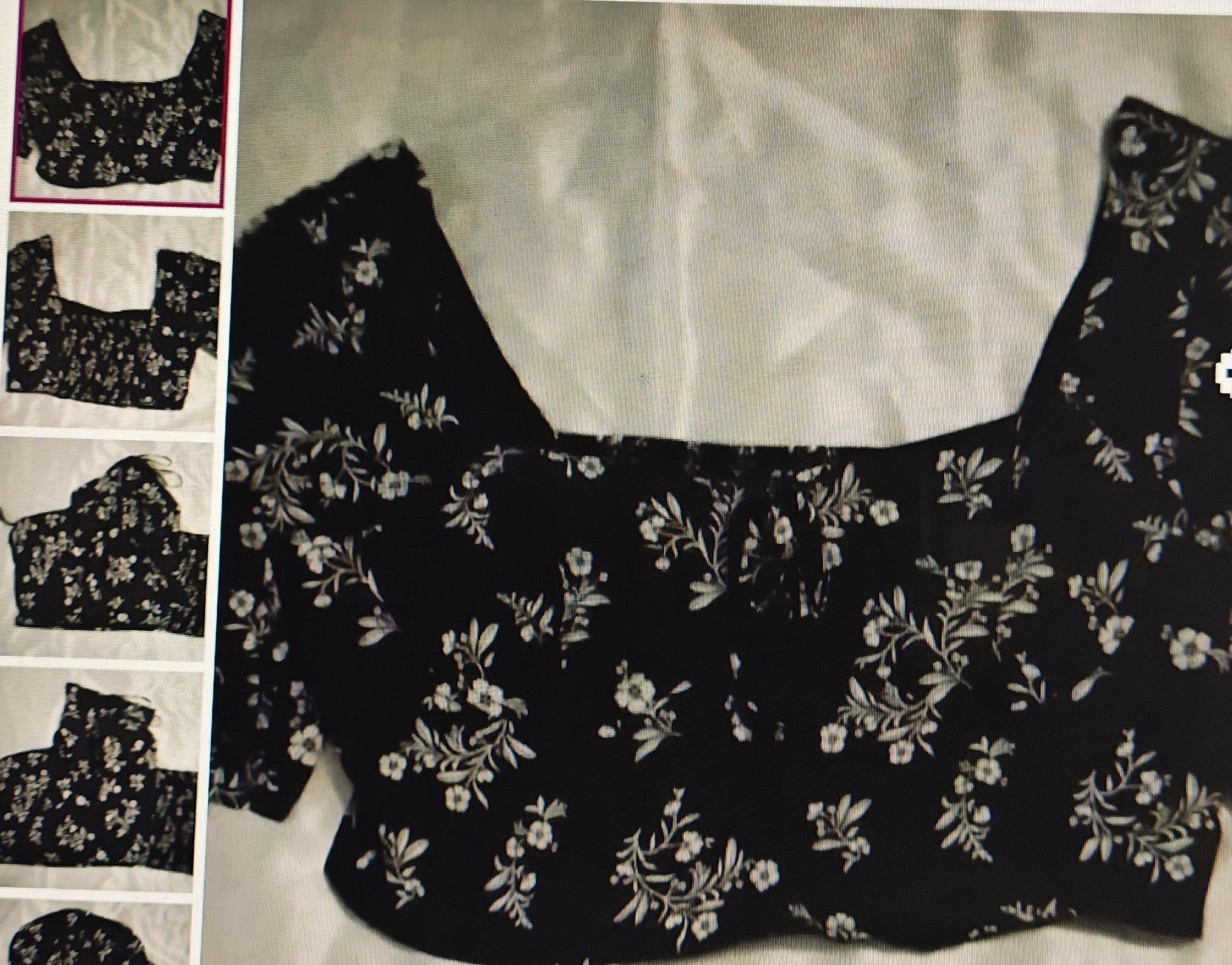 Black floral-patterned top on a white background with smaller images on the left.