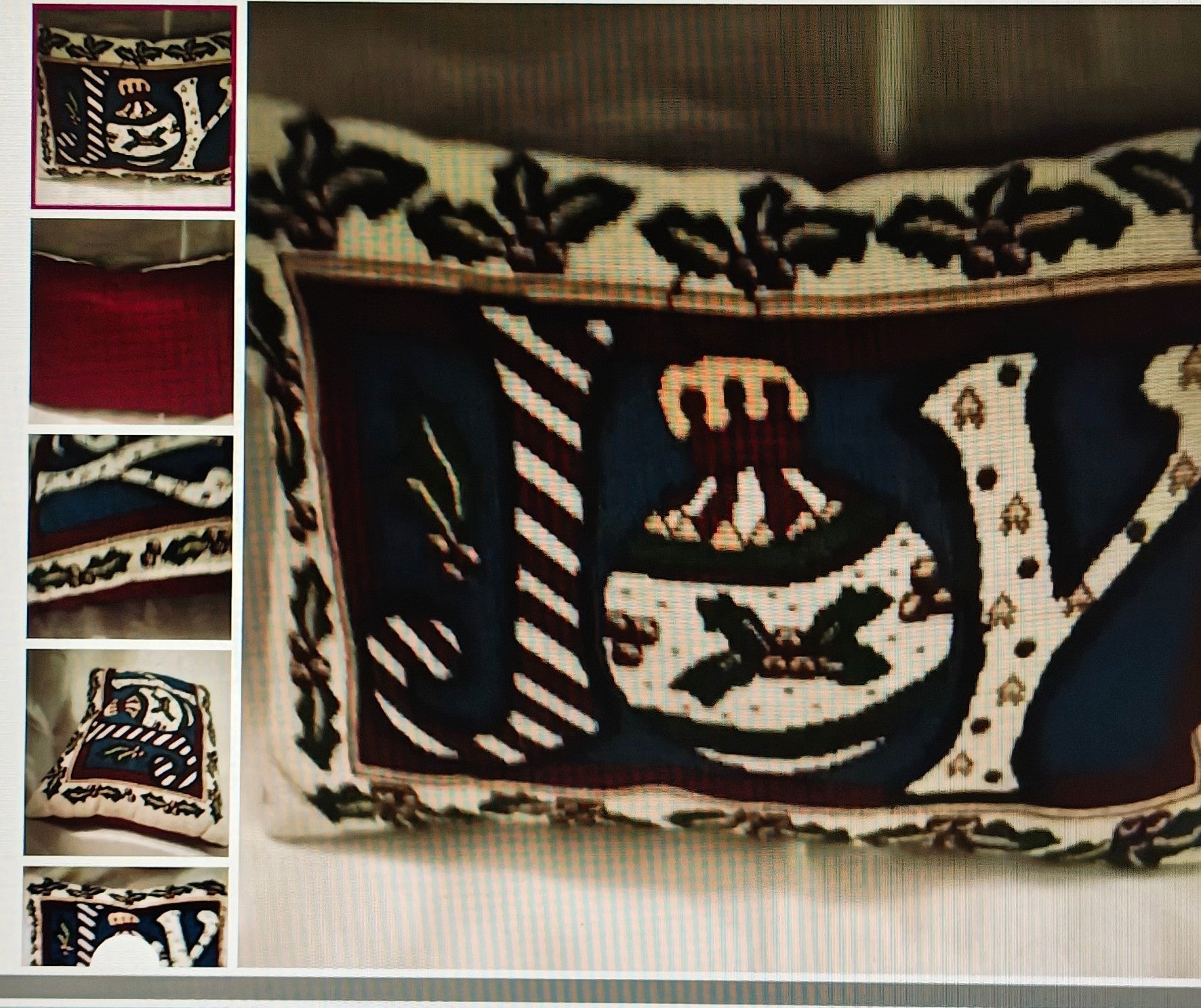 Decorative pillow with intricate patterns and embroidery on a neutral background