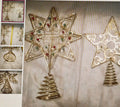 Decorative star ornament with spiral base on a textured surface