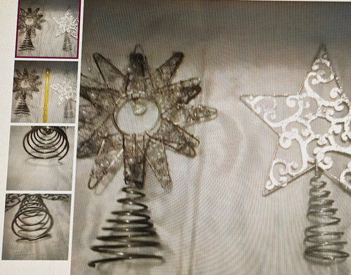 Decorative metal tree and star ornaments on a white background