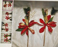Decorative flower sticks with red flowers and green leaves on a white background.