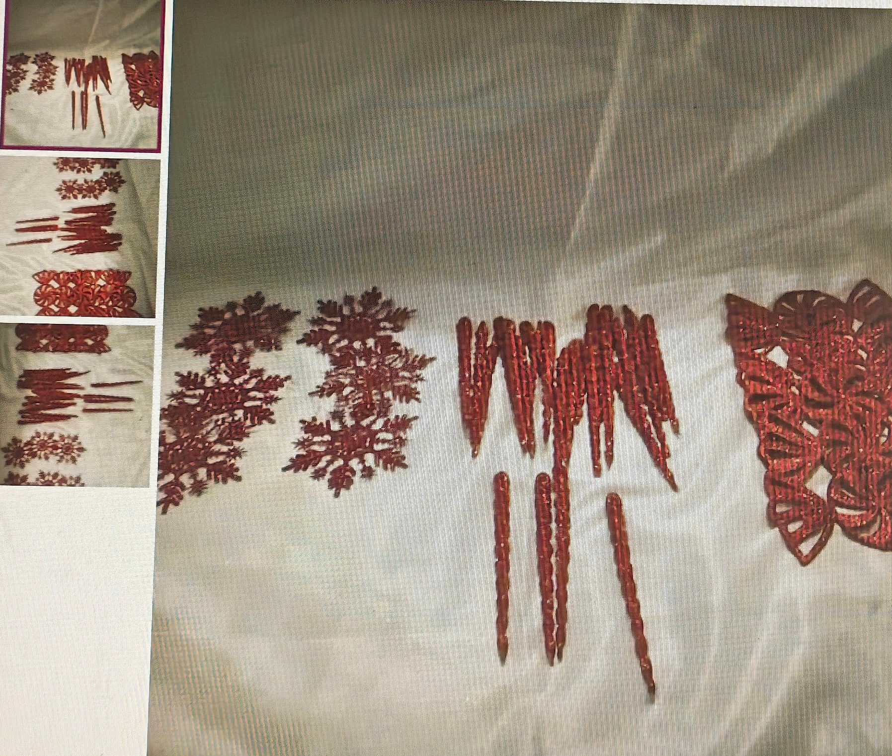 Embroidered fabric with red floral patterns on a beige background