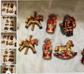 Collection of decorative figurines on a textured surface
