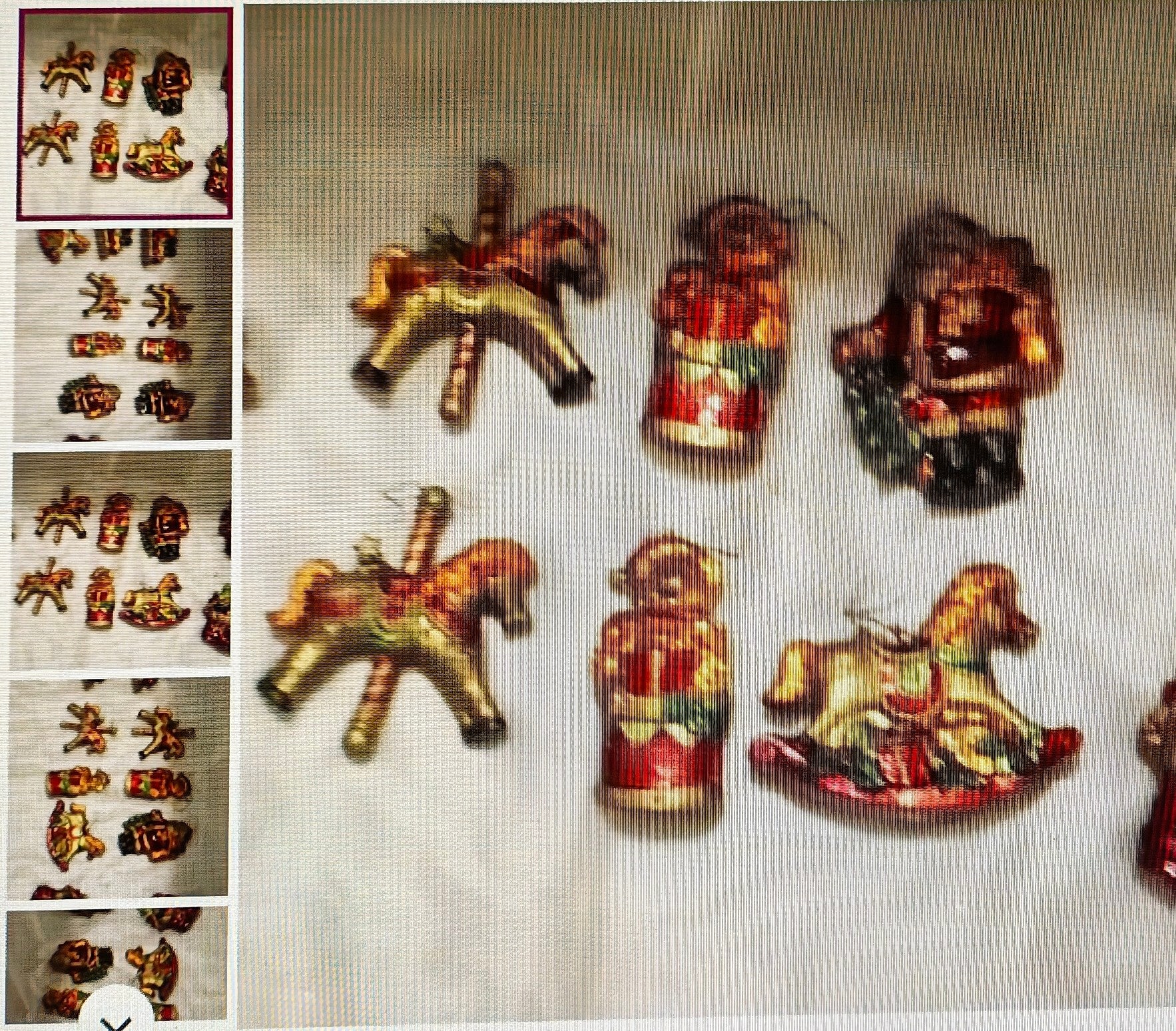Collection of decorative figurines on a textured surface