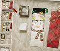 Collection of gift bags and boxes on a textured surface