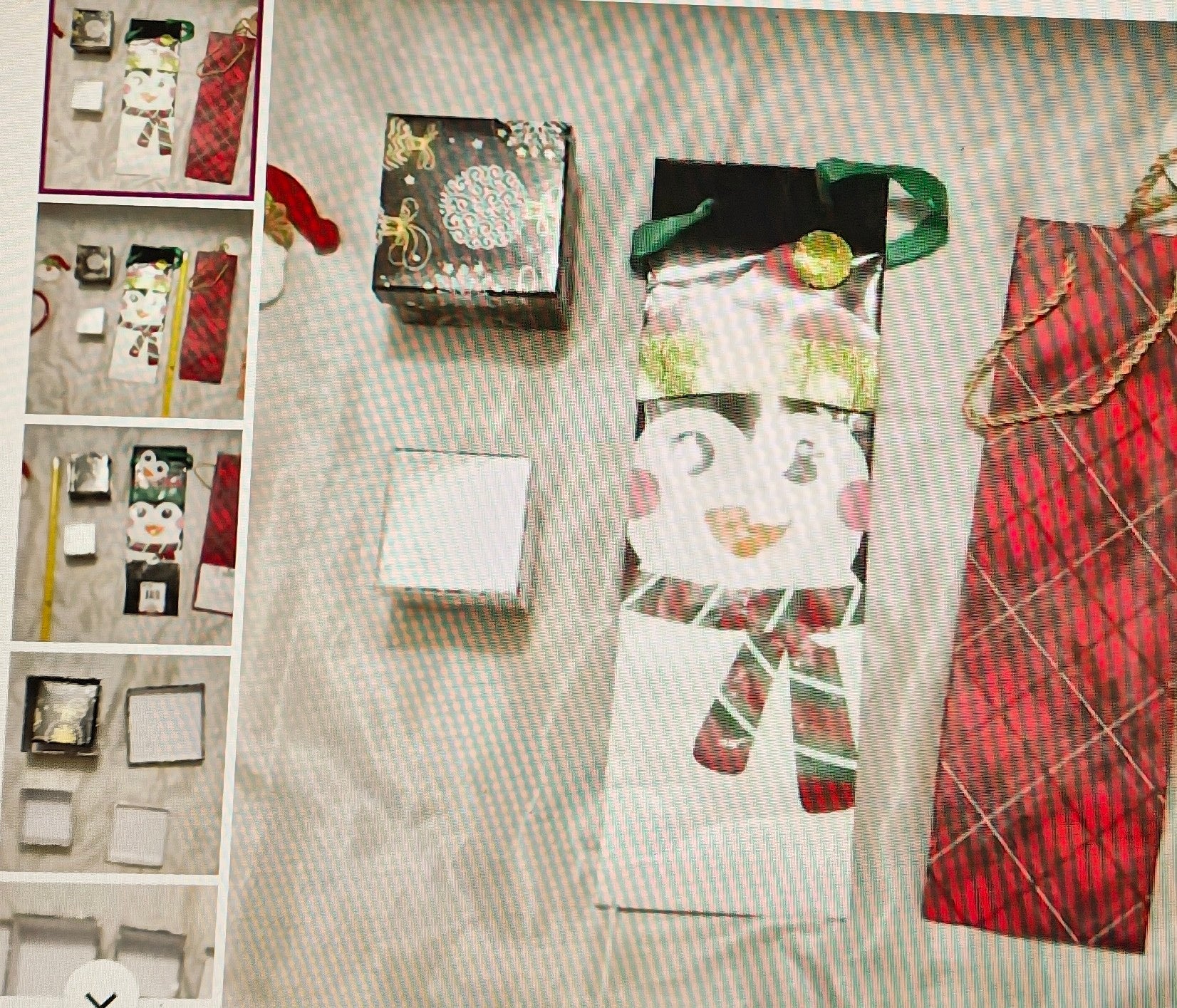 Collection of gift bags and boxes on a textured surface