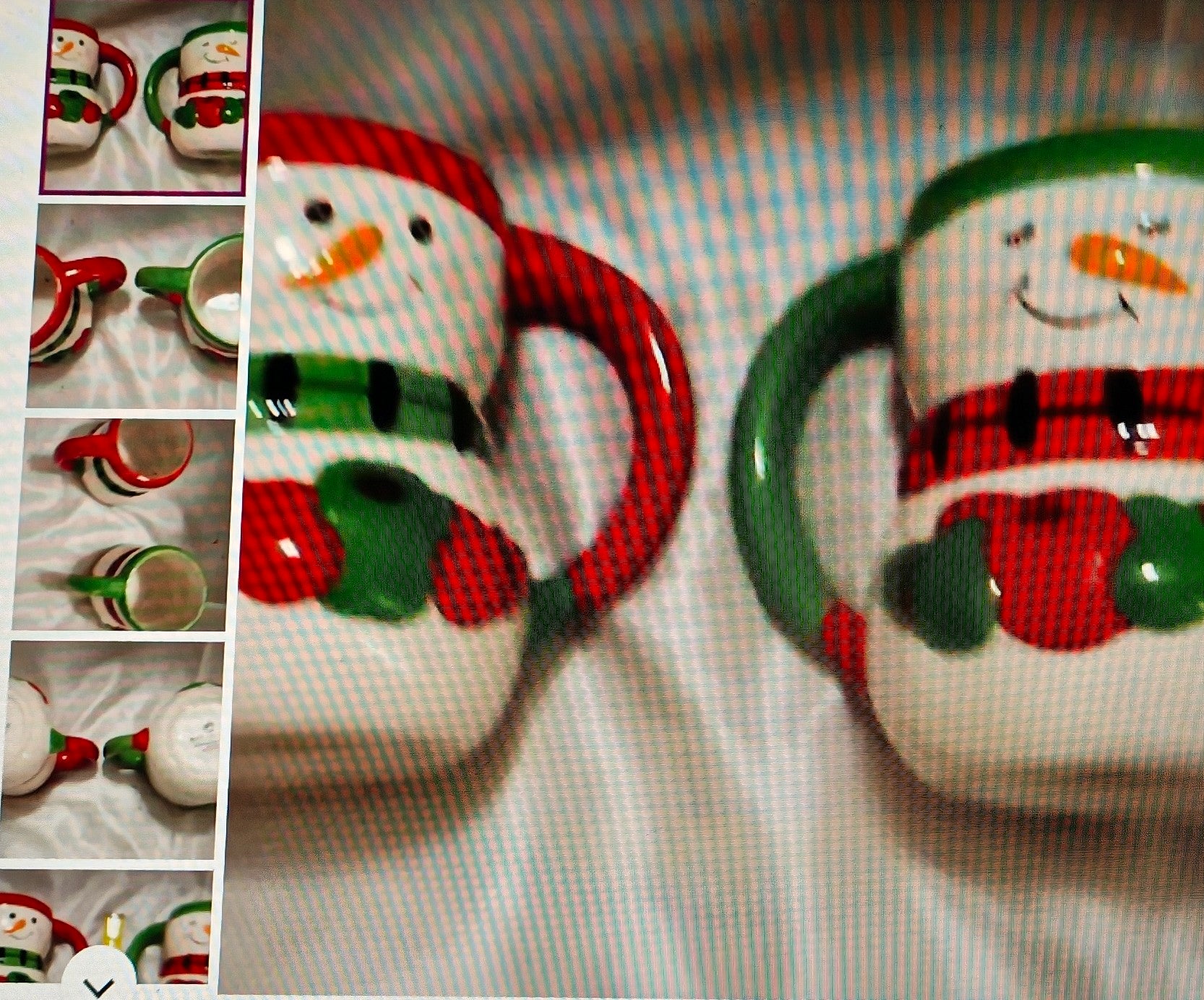 Snowman-themed mugs with red and green accents on a checkered fabric background.