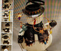 Toy carousel with black and white figures on a textured background