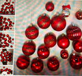 Red Christmas ornaments on a reflective surface with close-up inset showing individual ornaments.