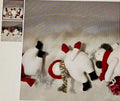 Decorative paper with snowmen and a reindeer design on a textured surface.