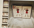 Notebook with decorative pages featuring cartoon characters on a textured surface.