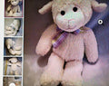 Stuffed lamb toy with a bow tie on a textured background