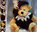 Colorful teddy bear with a decorative collar on a patterned background