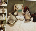 Collection of stuffed animals including a rabbit, dolphin, and others on a textured surface.