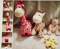 Collection of stuffed animals including giraffes and a bear on a textured surface.