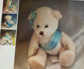Teddy bear with a blue ribbon and tag, surrounded by smaller images of the same teddy bear.