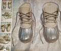 Illustration of a pair of lace-up shoes on a textured surface with smaller inset images showing different angles.