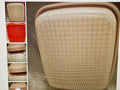 Close-up of a woven seat cover with color swatches on the side.