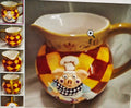 Decorative mug with cartoon pig design on a reflective surface
