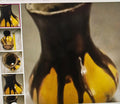 Close-up of a ceramic vase with a yellow base and black top, surrounded by other similar vases.