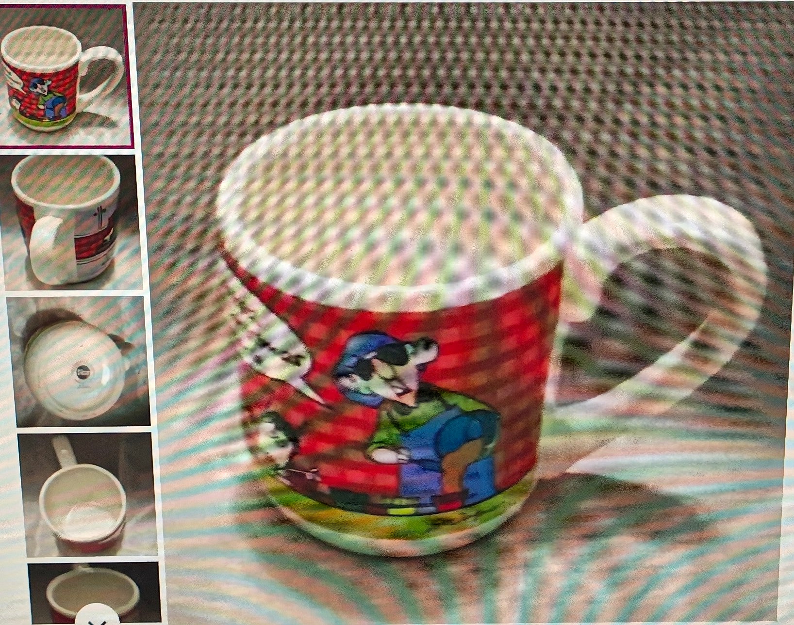 Colorful mug with cartoon design on a striped surface