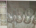 Clear glass light bulbs on a textured surface with a close-up inset showing details.