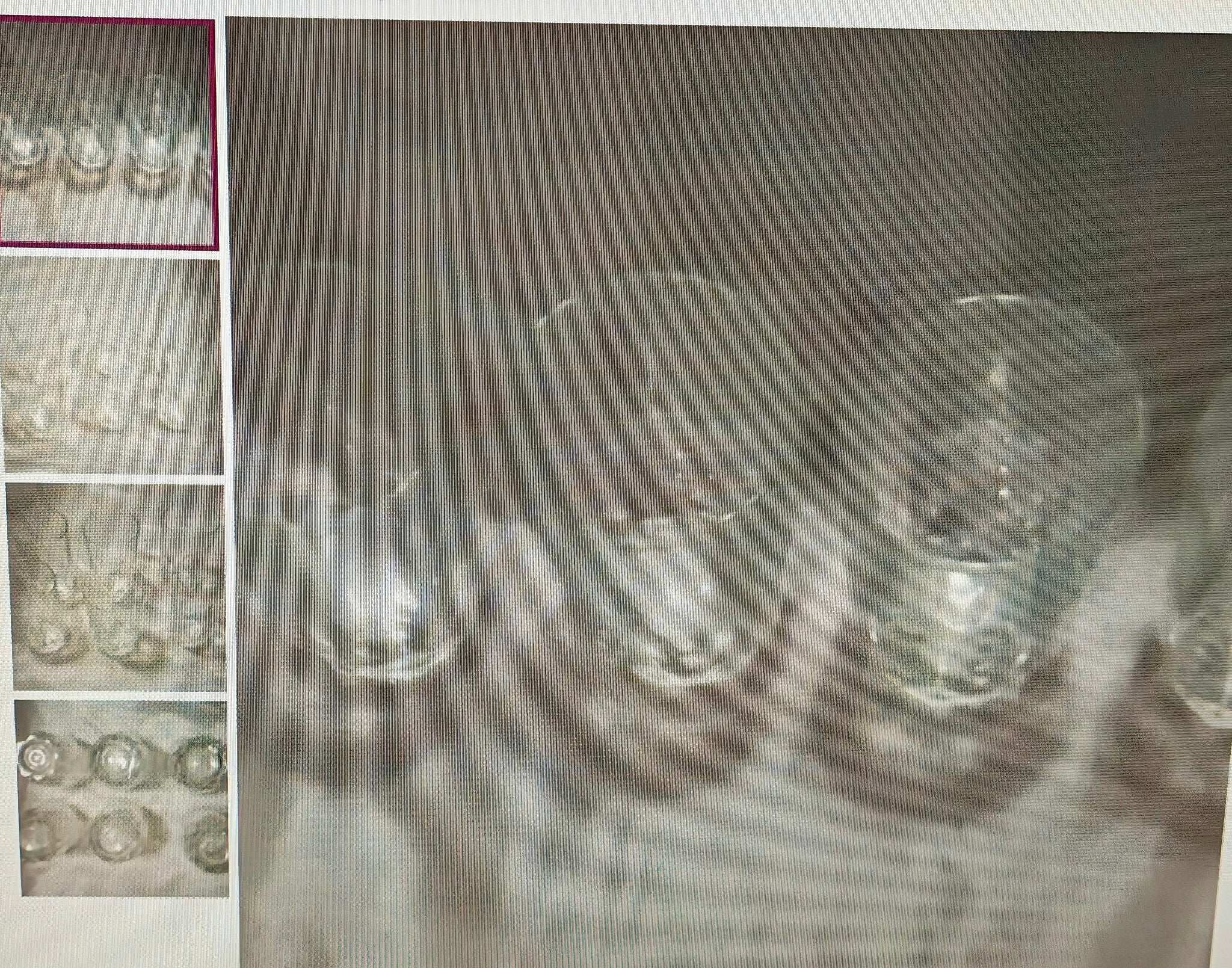 Clear glass light bulbs on a textured surface with a close-up inset showing details.