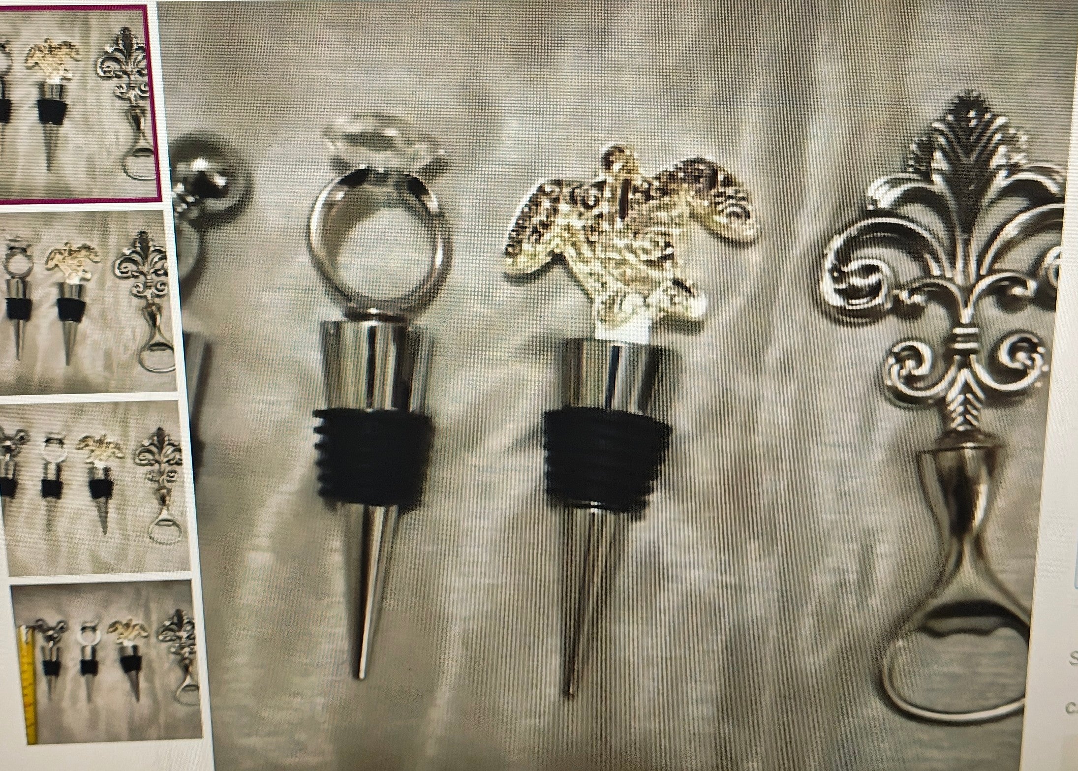 Collection of decorative bottle stoppers on a textured surface with additional stoppers in the background.