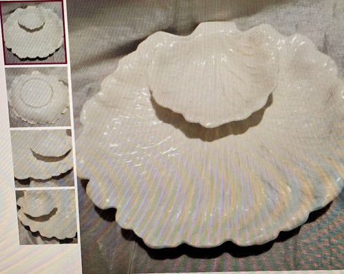 White ceramic shell-shaped dish on a textured surface with close-up insets showing detailed texture.