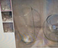 Clear glassware on a textured surface with inset images showing different angles.
