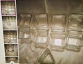 Clear plastic containers on a reflective surface with multiple views shown.