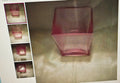 Pink glass vase on a reflective surface with smaller images of the vase in corners.