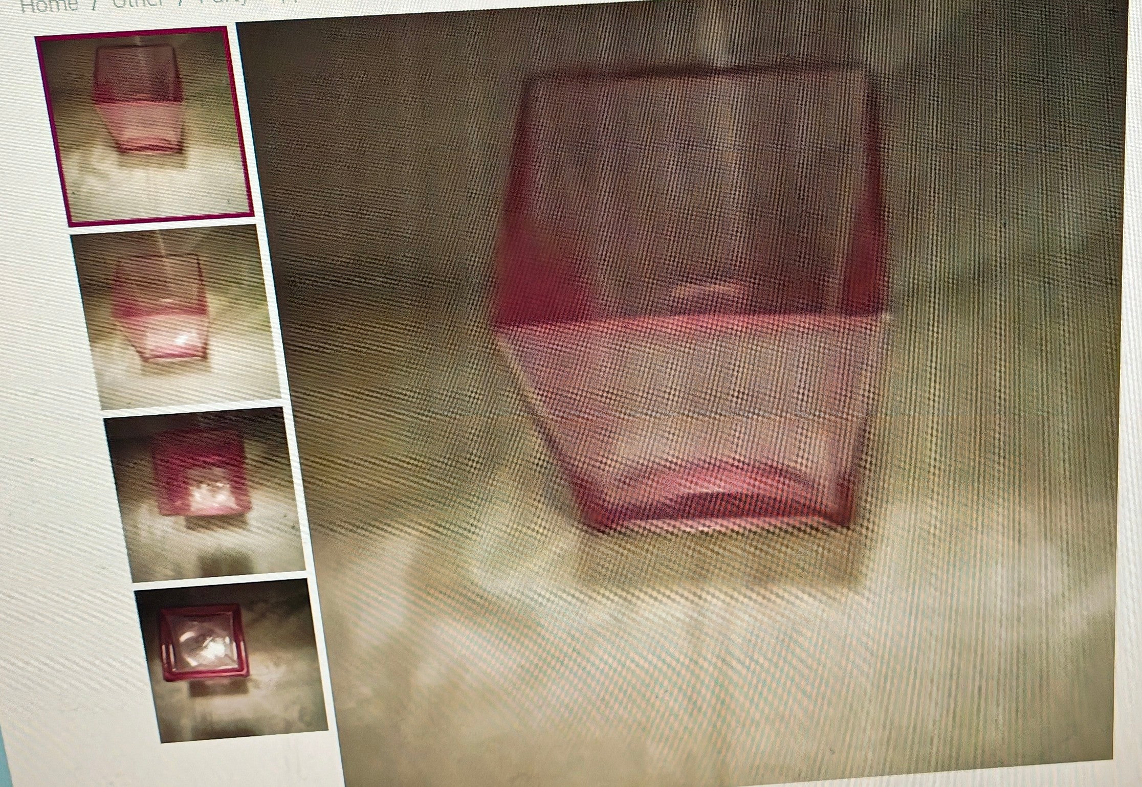 Pink glass vase on a reflective surface with smaller images of the vase in corners.