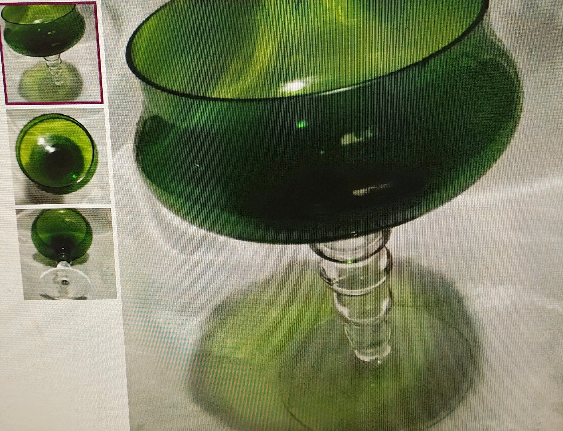 Green glass object with a textured surface on a white background