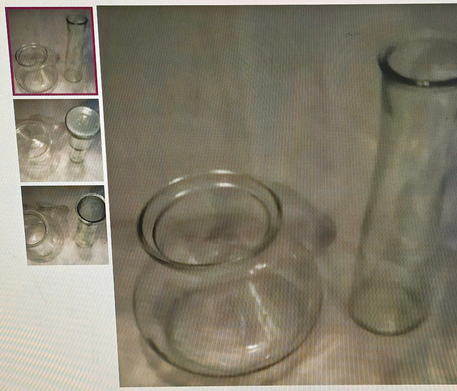 Clear glass bowls and a vase on a textured surface with inset images.