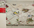 Decorative tablecloth with bird pattern under clear plastic