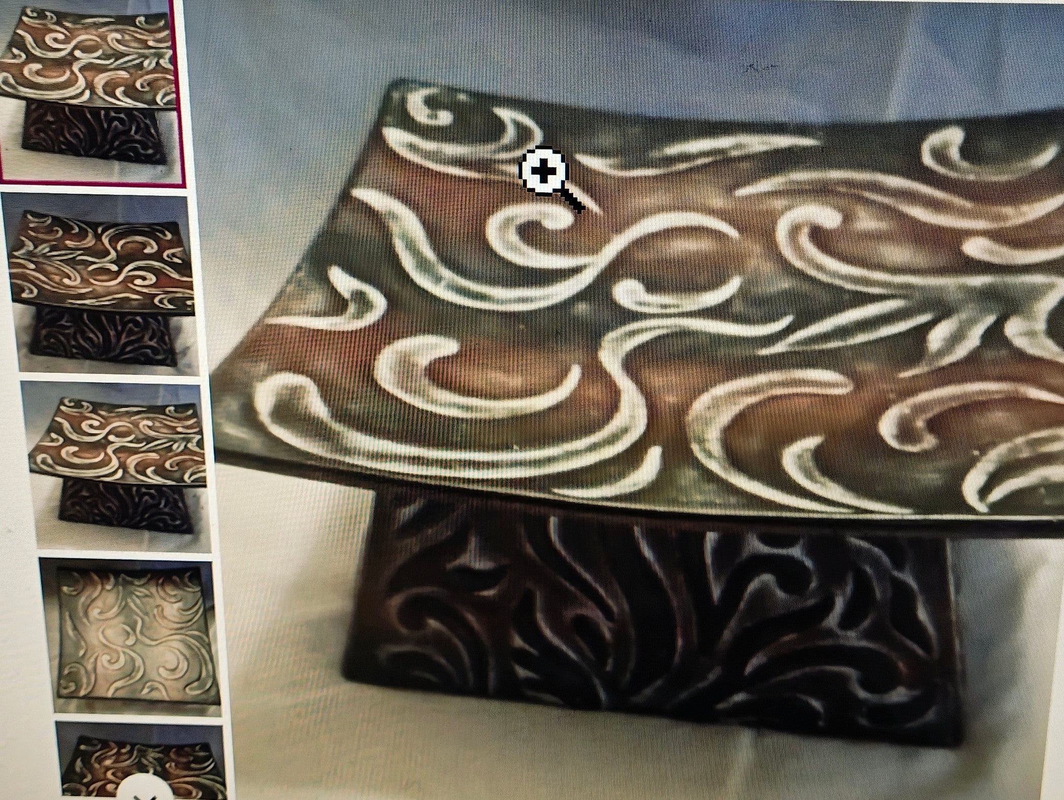 Decorative ceramic piece with intricate patterns on a white background