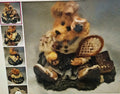 Decorative teddy bear figurine with a basket and 'The Big Book of Love' sign, surrounded by smaller images of the same bear.