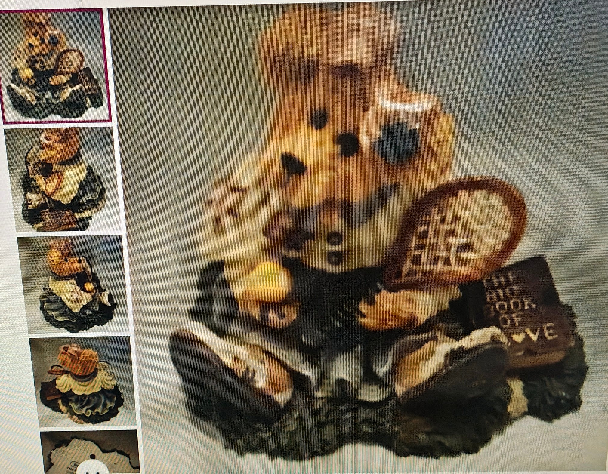 Decorative teddy bear figurine with a basket and 'The Big Book of Love' sign, surrounded by smaller images of the same bear.
