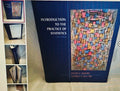 Book titled 'Introduction to the Practice of Statistics' by David S. Moore and George P. McCabe on a light background.