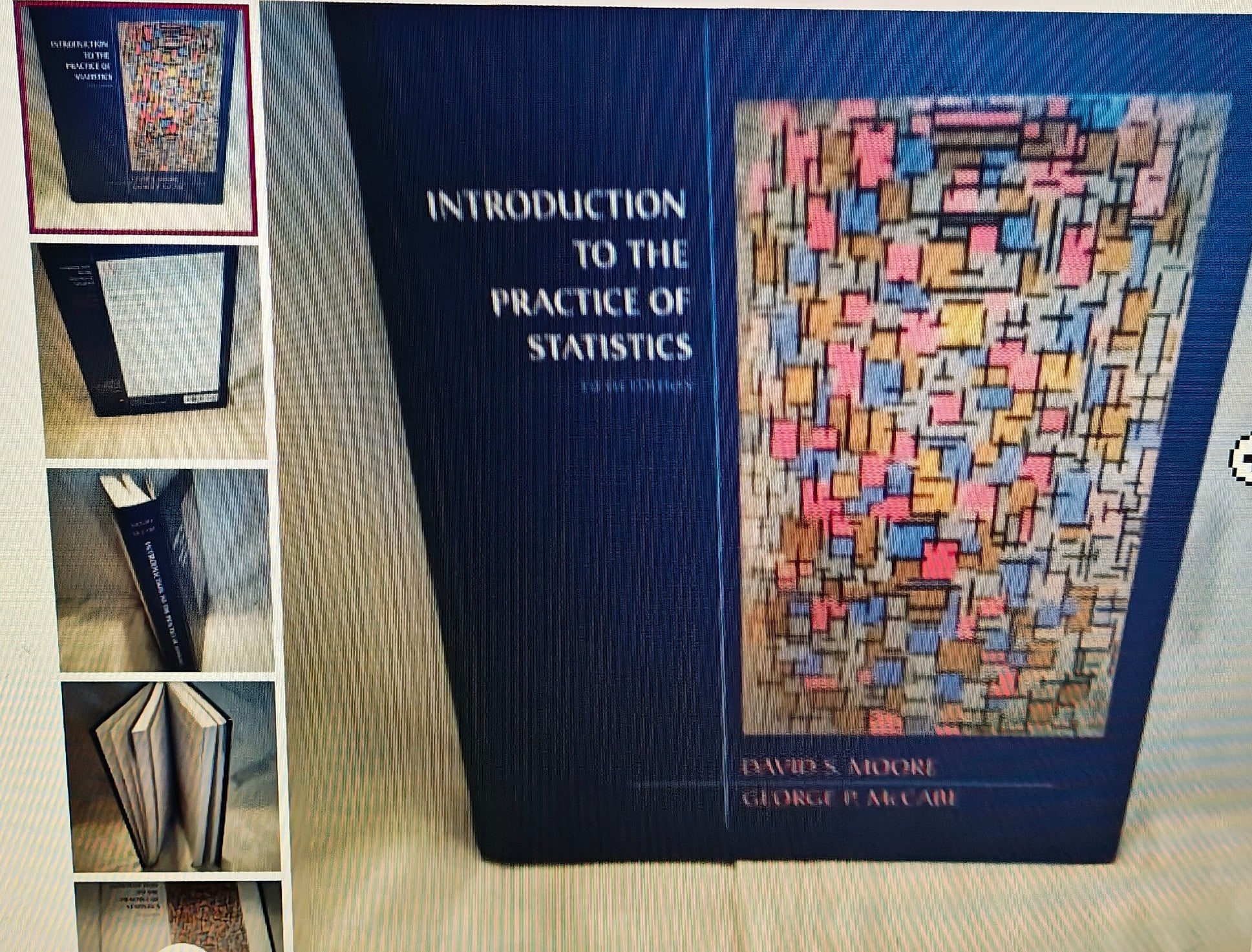 Book titled 'Introduction to the Practice of Statistics' by David S. Moore and George P. McCabe on a light background.